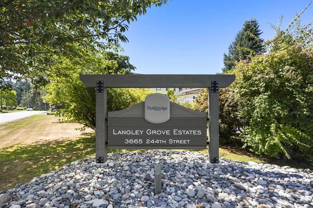 image shows signage for the community Langley Grove Estates