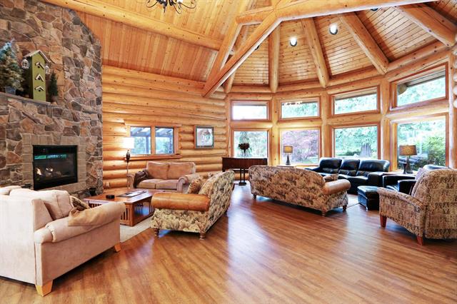 Image shows living room seating area in the clubhouse at The Cottages at Bridal Falls 53480 Bridal Falls Road