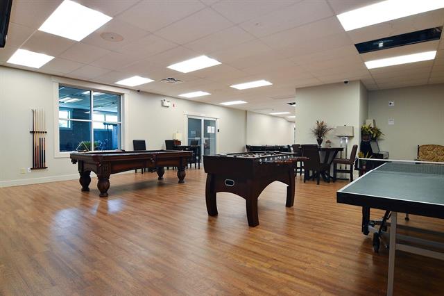 image shows the games room in the clubhouse at The Cottages at Bridal Falls 53480 Bridal Falls Road